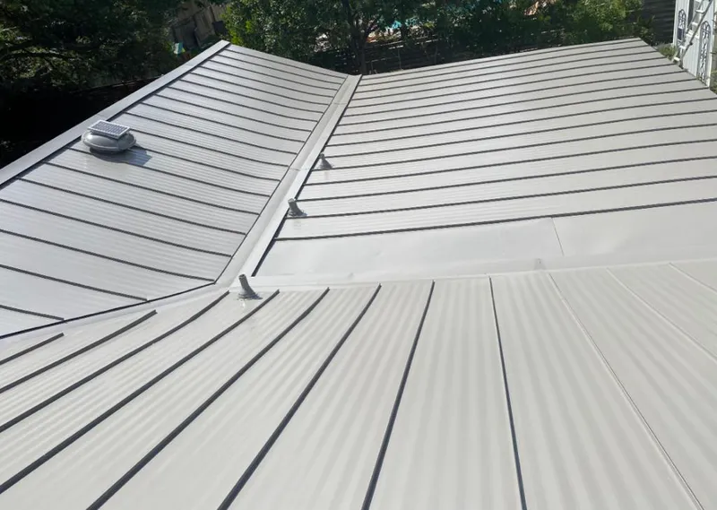 Solar attic fan installed on a metal roof for Roof Ventilation in South St. Paul